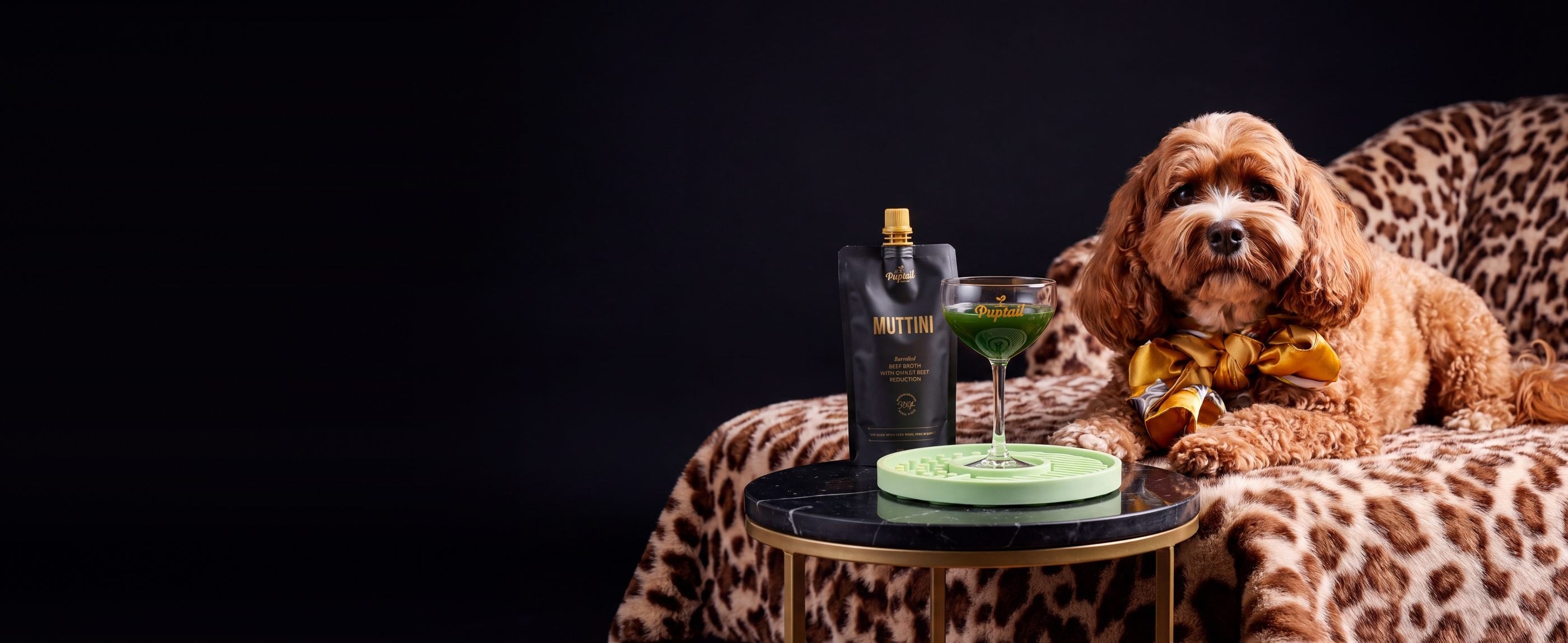 A cavoodle with a Muttini and a Poochtini Glass